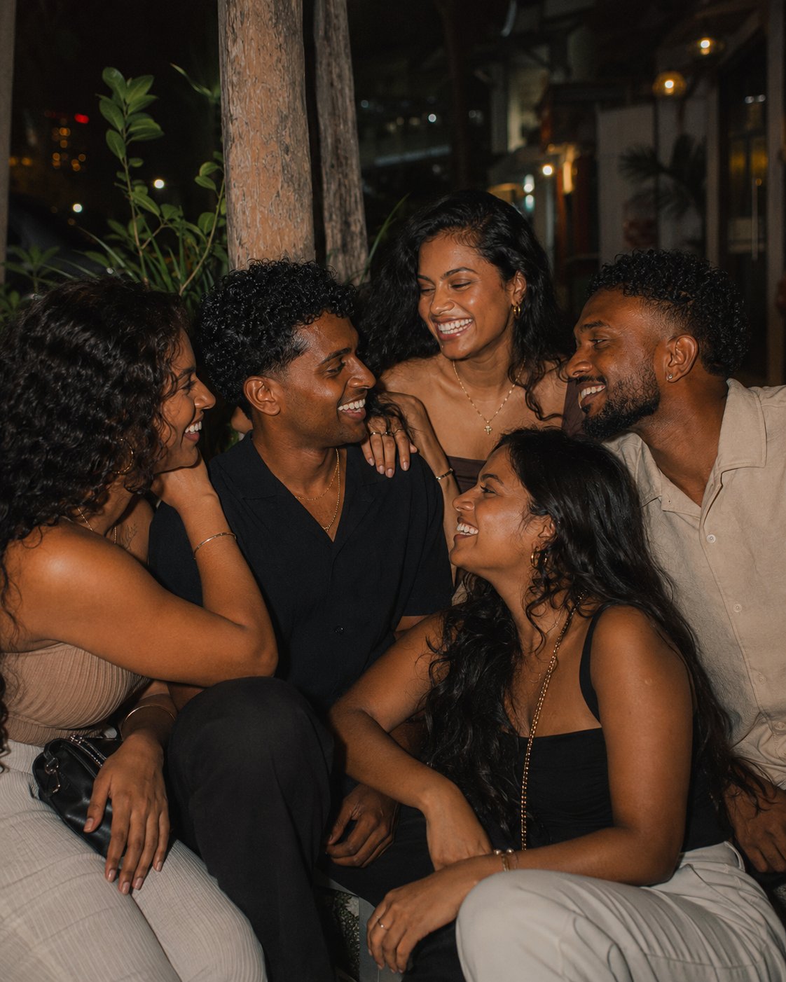 Strangers community close together at night